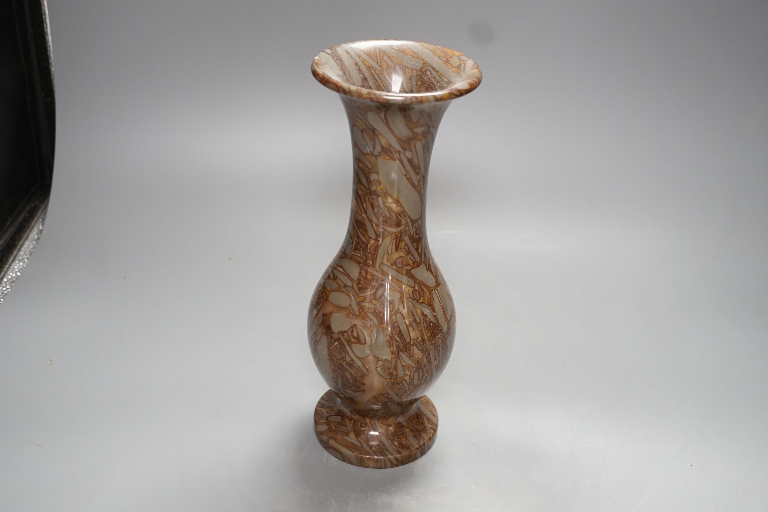 A pudding stone vase - 28cm high